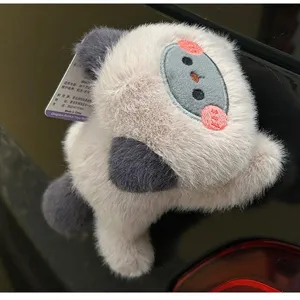 Close-up of cute plush magnetic cat sticker showing soft fur texture and car mounting