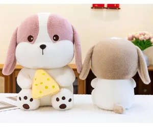 Detail showing the front and back of a soft plush puppy doll holding a slice of yellow cheese