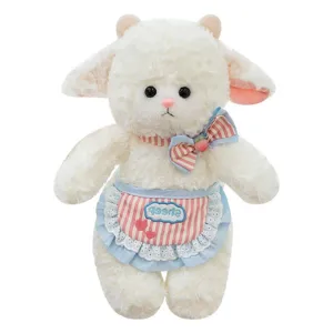 Cute white plush lamb toy wearing a pink striped apron and bow on white background