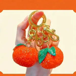Adorable handcrafted simulation resin orange fruit keychains with luxury golden ring