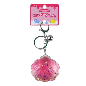 Porte-clés coquillage en acrylique rose avec paillettes liquides et clochette