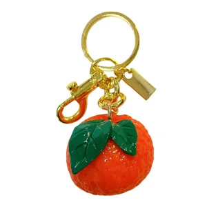 Cute resin mandarin orange keychain with realistic fruit texture and gold hardware