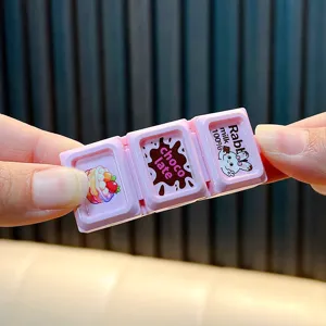 Cute pink chocolate-shaped stress relief toy keychain with a cartoon rabbit design