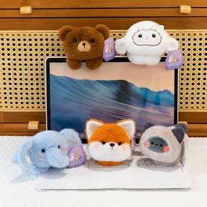 Collection of cute cartoon animal plush magnets decorated on a laptop screen