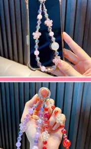 Close-up of colorful crystal beaded phone charms featuring delicate flower designs.
