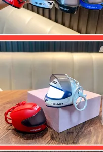 Detailed view of luminous motorcycle helmet keychains in red and white colors
