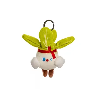 Close-up detail of a cute cartoon vegetable plush keychain featuring a red ribbon bow