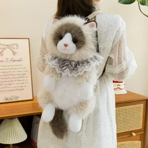 Cute ragdoll cat plush backpack with lace collar worn by a girl in cozy home setting