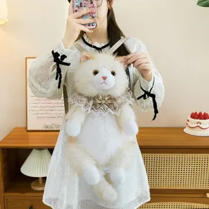 Close-up detail of a fluffy ragdoll cat plush backpack with lace collar and bow tie decor