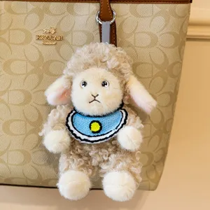 Cute curly wool plush lamb keychain bag charm with a blue bib accessory for backpacks