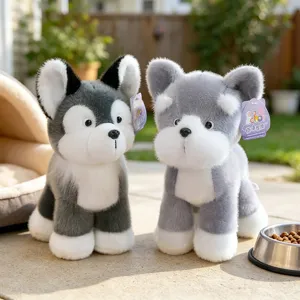 Pair of realistic husky puppy plush toys in an outdoor garden setting for children's gifts.