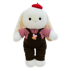 Adorable white plush bunny toy in red beret and brown overalls, soft stuffed animal