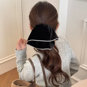 Elegant black velvet hair scrunchie with sparkling rhinestones for low ponytail