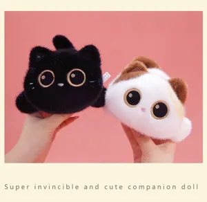 Detailed view of two adorable plush cat dolls, one black and one calico kitten