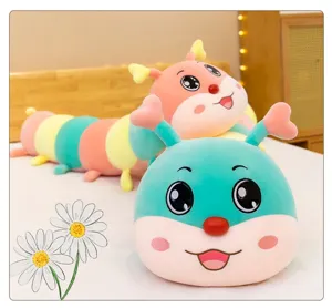 Close-up of colorful caterpillar plush pillow with cute cartoon face and soft texture