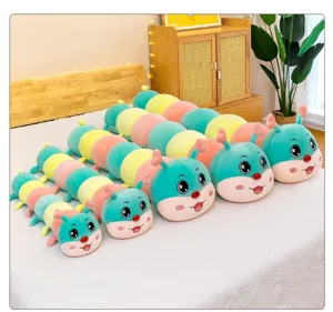 Detailed view of colorful caterpillar plush long pillows in a cozy bedroom