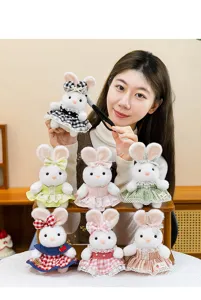Collection of cute plush rabbit keychains wearing various colorful checkered lace dresses.