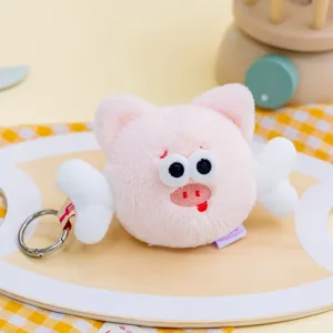 Detailed view of a soft pink winged plush pig keychain schoolbag hanging ornament gift
