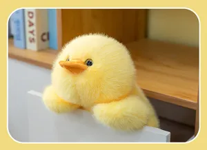 Detailed close-up view of the soft and fluffy yellow duck plush toy in a resting pose