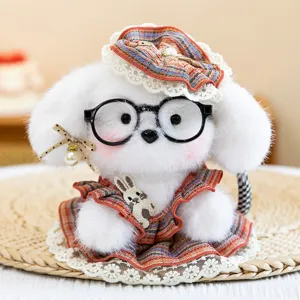 Adorable plush white puppy keychain charm wearing glasses and a cute stylish plaid dress