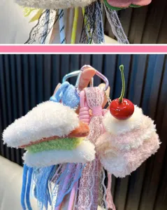 Detail view of handmade plush burger and cake dessert bag charms with cute lace ribbons