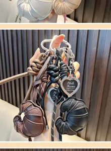 Close-up of leather croissant keychains with heart-shaped photo frame charms.