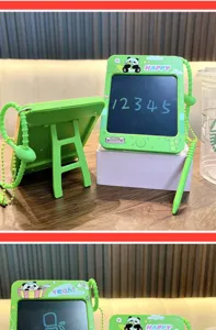 Close-up view of a panda-themed mini green graffiti drawing board toy with a stylus