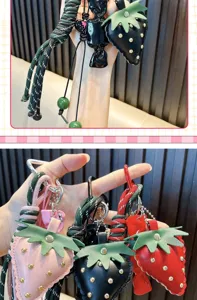 Close-up of handmade leather strawberry keychains with colorful braided ropes