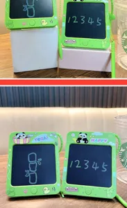 Close-up detail of green panda-themed mini LCD writing tablet keychain with stylus