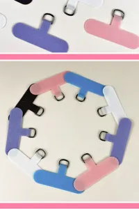Universal multi-color phone lanyard tether tabs with metal D-rings in circular layout.