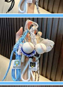 Close-up of baseball keychain with braided rope and mini sports equipment details.