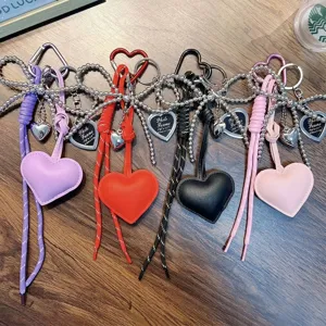 Colorful PU leather heart keychains with woven cord and metal charms for bag decor