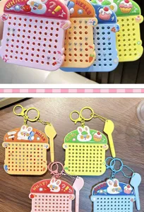 Detailed view of colorful rabbit magnetic bead drawing board keychains with magnetic pens.