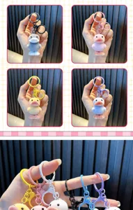 Detailed close-up of colorful flocked duck keychains in various vibrant pastel colors.