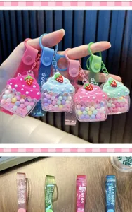 Detailed view of colorful cupcake liquid keychains with vibrant sugar beans and charms
