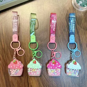 Set of colorful cupcake keychains featuring strawberry charms and glitter jelly bean oil straps