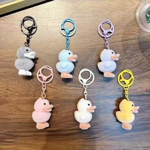 Collection of six colorful flocked duck keychains featuring cute cartoon duckling dolls