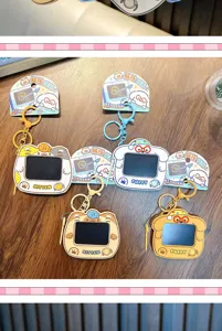 Close-up of cute kitten and puppy mini drawing board keychains in various colors