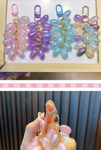 Detailed close-up view of the creative iridescent grape keychain with shimmering translucent beads.