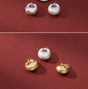 Detailed view of 999 silver gold plated Chinese style Fu character charm pendant DIY.