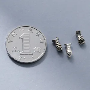 Vue macro de perles d'espacement poisson vintage en argent 925 de 6mm pour bijoux faits main
