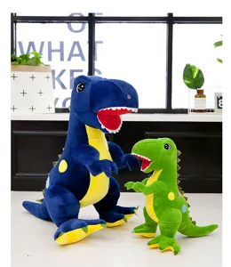 Dos coloridos peluches de dinosaurio Tyrannosaurus Rex en azul y verde puestos juntos