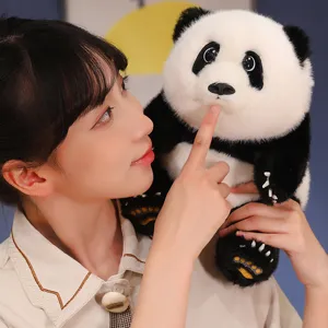 A highly realistic panda plush toy with soft black and white fur held by a young girl