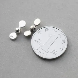 Detail of 925 sterling silver propeller spacer beads for DIY jewelry size comparison