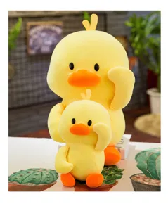 Close-up of a cute yellow duck plush toy set featuring soft fabric and charming poses