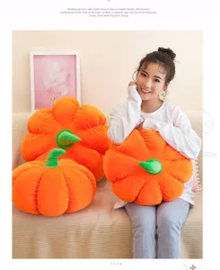 Soft orange pumpkin plush pillow held by a model in a cozy home setting, perfect for Halloween