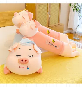 Detail of cute pink pig plush pillows and toys in a cozy bedroom setting