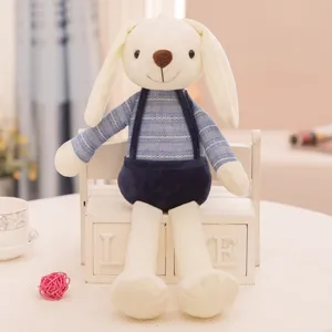 Cute white rabbit plush doll toy wearing a blue striped shirt and navy blue overalls