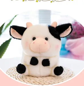 Cute black and white cow plush toy detail view, soft stuffed animal doll for kids gift.