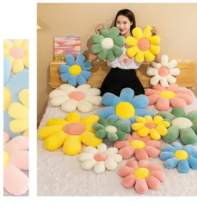 Cozy daisy flower plush cushions in various colors displayed on a bed for room decor